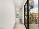Hallway leading to a spiral staircase with view of the mountains in the distance at 3510 Cosima Ln, Las Vegas, NV 89120