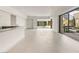 Open concept living room with access to the outdoor pool area and spiral staircase at 3510 Cosima Ln, Las Vegas, NV 89120