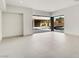 Bright living room with views of the modern pool and lush landscaping at 3510 Cosima Ln, Las Vegas, NV 89120