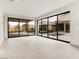 Open living space with expansive glass doors overlooking pool and landscaped backyard at 3510 Cosima Ln, Las Vegas, NV 89120