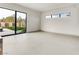 Bright living room featuring tile floors, large windows and seamless indoor/outdoor flow at 3510 Cosima Ln, Las Vegas, NV 89120