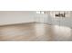 Bright and open loft area features wood floors, railing and large windows at 3510 Cosima Ln, Las Vegas, NV 89120