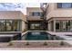 Backyard pool features a modern spiral staircase and multiple access points for easy outdoor living at 3510 Cosima Ln, Las Vegas, NV 89120