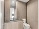 Stylish powder room with a decorative vanity, modern fixtures and neutral tones at 3510 Cosima Ln, Las Vegas, NV 89120