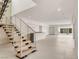 Stylish staircase with wood treads and stainless steel railings leads to upper level at 3510 Cosima Ln, Las Vegas, NV 89120