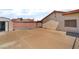 Spacious backyard with a covered patio, storage shed, and concrete paving at 411 Monmouth Ct, Henderson, NV 89015