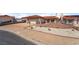 Charming exterior elevation features a large driveway and well-maintained landscape at 411 Monmouth Ct, Henderson, NV 89015