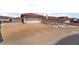 Single-story house with a two-car garage and a wide driveway; desert landscaping and terracotta roof tiles at 411 Monmouth Ct, Henderson, NV 89015