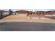 Charming single-story home with a two-car garage, desert landscaping, and a terracotta tile roof at 411 Monmouth Ct, Henderson, NV 89015