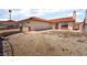 Well-kept front exterior with desert landscaping, concrete driveway, and an attached two-car garage at 411 Monmouth Ct, Henderson, NV 89015