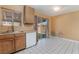 Kitchen with sliding glass doors to backyard, wood cabinets, and tile flooring at 411 Monmouth Ct, Henderson, NV 89015