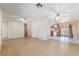 Open-concept living room with tile floors, access to the kitchen and views to the back yard at 411 Monmouth Ct, Henderson, NV 89015