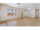 Open living room filled with natural light from a large window at 411 Monmouth Ct, Henderson, NV 89015