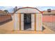 Backyard storage shed with open doors and interior shelving at 411 Monmouth Ct, Henderson, NV 89015