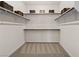 A walk-in closet with shelves and rods provides ample storage space at 4360 E Brusca Way, Pahrump, NV 89061