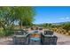 Outdoor lounge area features modern seating, a fire pit, and bocce ball court at 4360 E Brusca Way, Pahrump, NV 89061