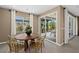 Inviting dining area with a round table, seating for six, and sliding doors leading to the outdoor patio at 4360 E Brusca Way, Pahrump, NV 89061