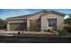 Charming single-story home with a neutral color scheme, a well-manicured lawn, and a two-car garage at 4360 E Brusca Way, Pahrump, NV 89061