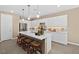 Modern kitchen with white cabinets, a large island, and stainless steel appliances at 4360 E Brusca Way, Pahrump, NV 89061