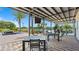 Inviting outdoor patio with tables and chairs, perfect for relaxing and enjoying the view at 4360 E Brusca Way, Pahrump, NV 89061