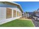 Backyard featuring a storage shed, sitting area, xeriscaping and grassy space at 4445 Peterson Dr, Las Vegas, NV 89103