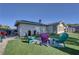 Backyard with artifical turf and lawn furniture at 4445 Peterson Dr, Las Vegas, NV 89103