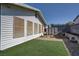 Backyard with artificial turf, stone accents, and a storage shed at 4445 Peterson Dr, Las Vegas, NV 89103