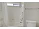 Full bathroom featuring a shower-tub combo, a toilet and chrome hardware at 4445 Peterson Dr, Las Vegas, NV 89103