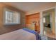 Comfortable bedroom featuring natural light, closet with built-ins, and ensuite bathroom at 4445 Peterson Dr, Las Vegas, NV 89103