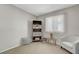 Neutral bedroom features light walls, carpet, and a window for natural light at 4445 Peterson Dr, Las Vegas, NV 89103