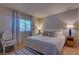 Bright bedroom with soft decor, accent chair, and natural light at 4445 Peterson Dr, Las Vegas, NV 89103
