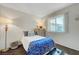 Bedroom boasts a comfortable bed, natural light, and soothing decor elements at 4445 Peterson Dr, Las Vegas, NV 89103
