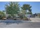 Charming single-story home with well-maintained landscaping and a driveway leading to the garage at 4445 Peterson Dr, Las Vegas, NV 89103