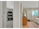 Hallway showing an open doorway into a bedroom and the end of another room at 4445 Peterson Dr, Las Vegas, NV 89103