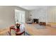 The living room features wood flooring, a stone fireplace and ample seating at 4445 Peterson Dr, Las Vegas, NV 89103