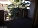 Condo Balcony with large palms and white railings at 4555 Sahara Ave # 252, Las Vegas, NV 89104