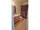 Bathroom featuring a wooden vanity and decorative shower curtain at 4555 Sahara Ave # 252, Las Vegas, NV 89104
