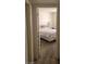 Bedroom with carpeted floor, bedding, and a peek into the room at 4555 Sahara Ave # 252, Las Vegas, NV 89104