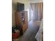 Bedroom with carpeted floor, dresser with Tv, and curtains at 4555 Sahara Ave # 252, Las Vegas, NV 89104