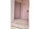 Condominium entryway featuring a solid door and a concrete landing with an exterior number at 4555 Sahara Ave # 252, Las Vegas, NV 89104