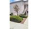 A well-maintained condominium exterior with mature landscaping and a private entrance with stairs at 4555 Sahara Ave # 252, Las Vegas, NV 89104