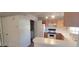 View of compact kitchen with white appliances, wood cabinets, and white counters at 4555 Sahara Ave # 252, Las Vegas, NV 89104