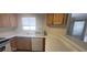 Bright kitchen featuring standard appliances, dual sinks and wood cabinets at 4555 Sahara Ave # 252, Las Vegas, NV 89104