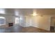 Bright open living room featuring a fireplace, ceiling fan, and vinyl flooring at 4555 Sahara Ave # 252, Las Vegas, NV 89104