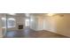 Bright open living room with a fireplace, ceiling fan, and hardwood floors at 4555 Sahara Ave # 252, Las Vegas, NV 89104