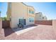 An attractive backyard features low-maintenance landscaping, a patio area, and block wall fencing at 4652 Wyncrest Ave, Las Vegas, NV 89115
