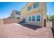 A spacious backyard features low-maintenance landscaping, a patio area, and block wall fencing at 4652 Wyncrest Ave, Las Vegas, NV 89115