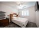 Bedroom featuring a comfortable bed, storage, and a sun-filled window with plantation shutters at 4652 Wyncrest Ave, Las Vegas, NV 89115