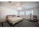 Bright bedroom with a comfortable bed, plantation shutters, and a dedicated exercise area at 4652 Wyncrest Ave, Las Vegas, NV 89115