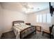 Bedroom features a ceiling fan, window with shutters, and a comfortable bed at 4652 Wyncrest Ave, Las Vegas, NV 89115